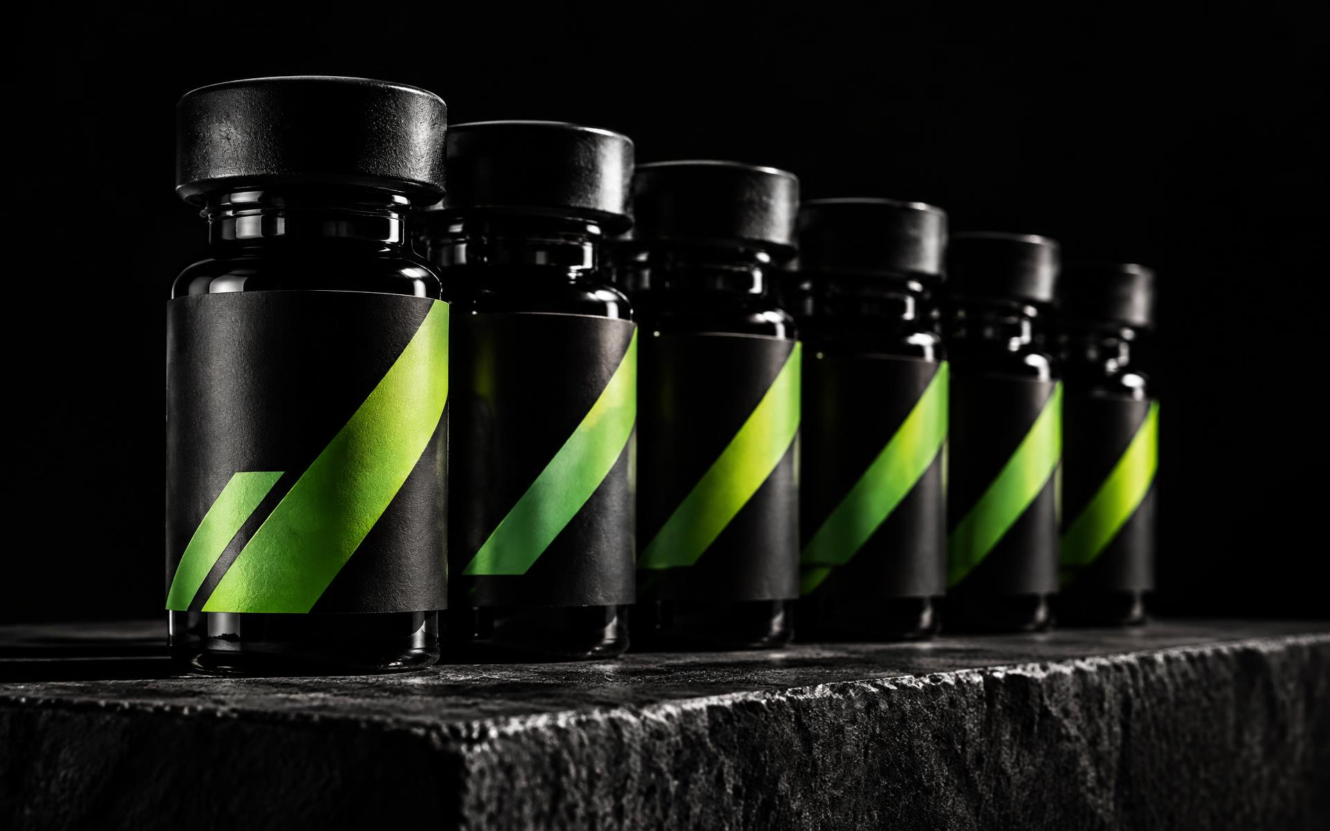 Row of black peptide vials with kinetic green labels